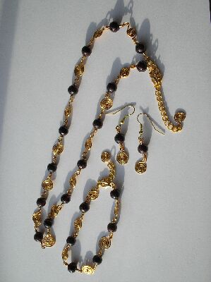 Garnet and hand crafted spiral necklace,bracelet and earrings